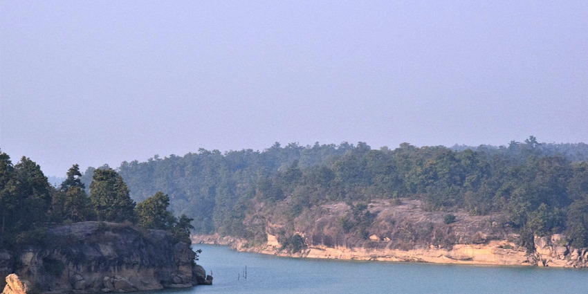 View of the Hasdeo River near Chandrahasini Temple, surrounded by mountains and greenery.