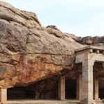 Man-made entrance pillars and steps leading to the rocky Hathigumpha caves, Odisha.