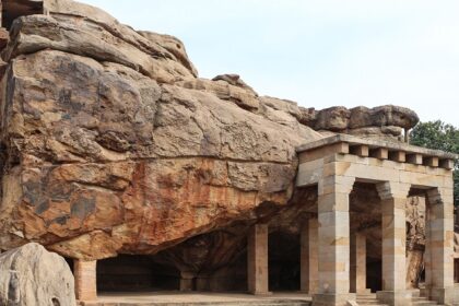 Man-made entrance pillars and steps leading to the rocky Hathigumpha caves, Odisha.