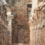 A picture of a fort's interiors with walls on both sides built using traditional architecture