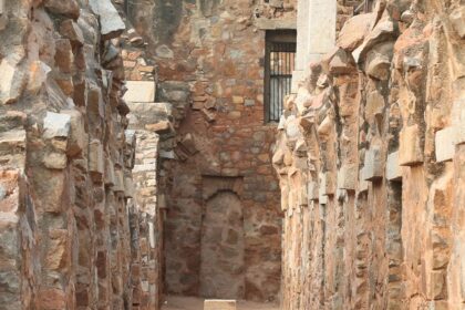 A picture of a fort's interiors with walls on both sides built using traditional architecture