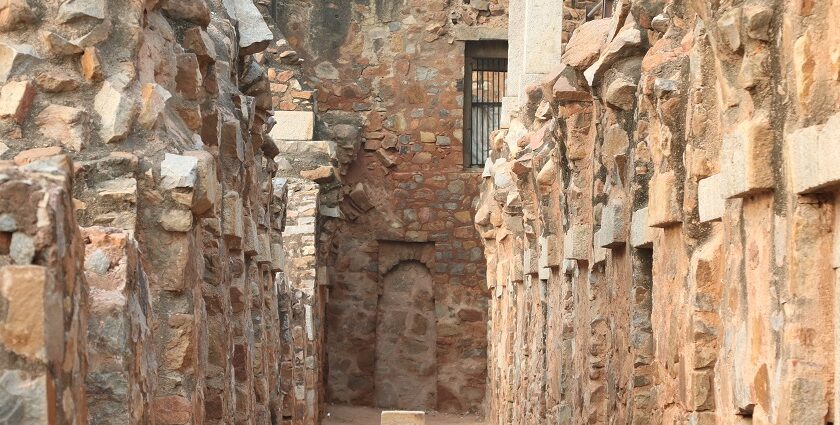 A picture of a fort's interiors with walls on both sides built using traditional architecture