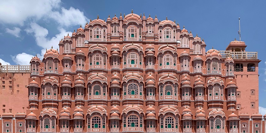 Hawa Mahal features 953 windows, and illuminated twilight, showcasing intricate design.