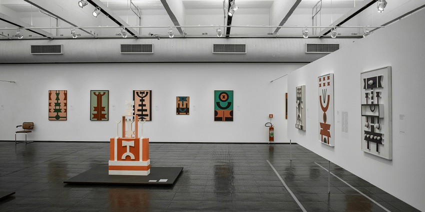 Inside the galleries of the art museum with creative pieces hanging on the wall