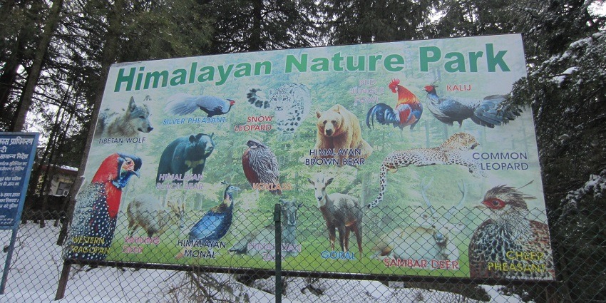 A board in front of the Himalayan Nature Park Kufri showcasing diverse wildlife