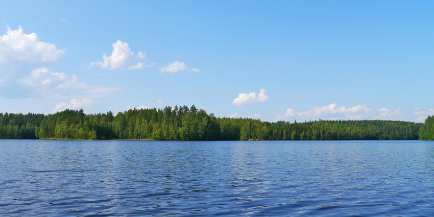 Scenic image of a lake surrounded by lush greenery, one of the best places to visit near Solapur