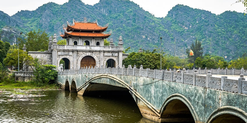 Historic Hoa Lu’s ancient temples and ruins set amidst dramatic karst hills offering a picturesque view