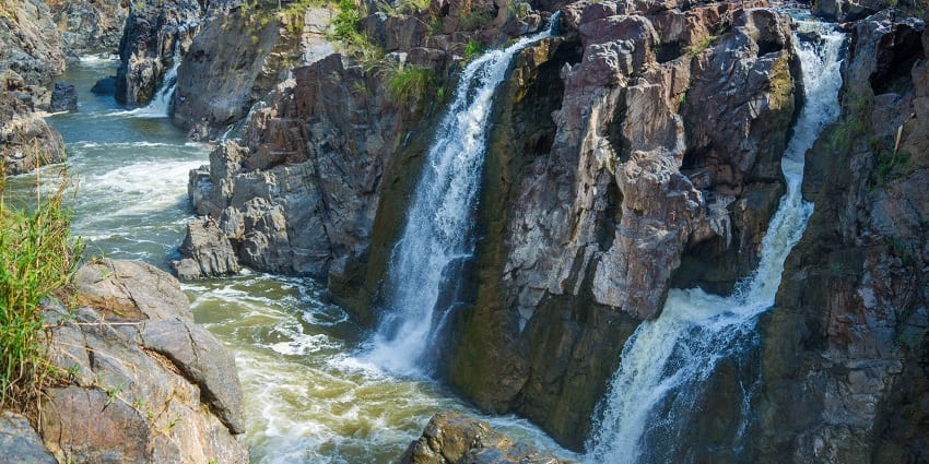 Magnificent view of Hogenakkal Falls, situated amidst rugged terrain