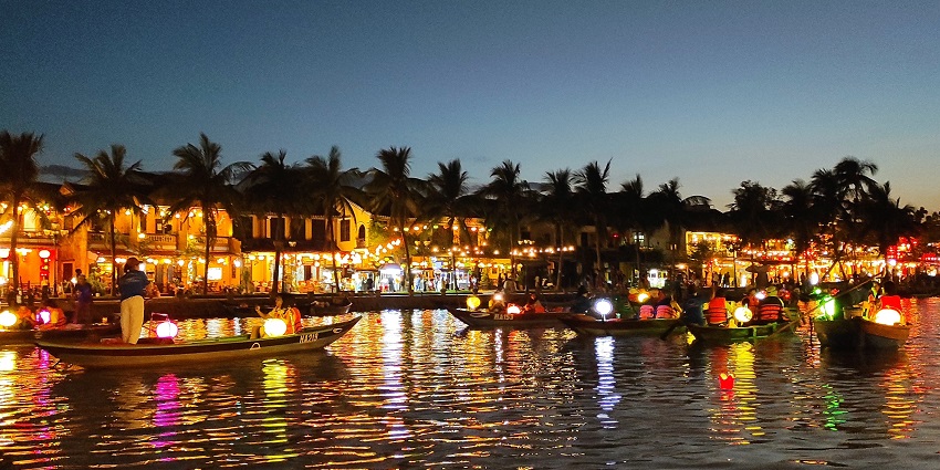 Market at night in Hoi An, lit by colourful lanterns; a romantic tourist place in Hoi An.
