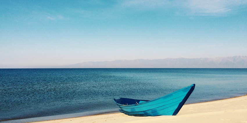 A glimpse of shimmering cobalt-blue waters and pristine golden sands of Hollant Beach.
