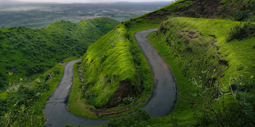 A breathtaking view of the Horsley Hills featuring lush green hills and cloudy skies.
