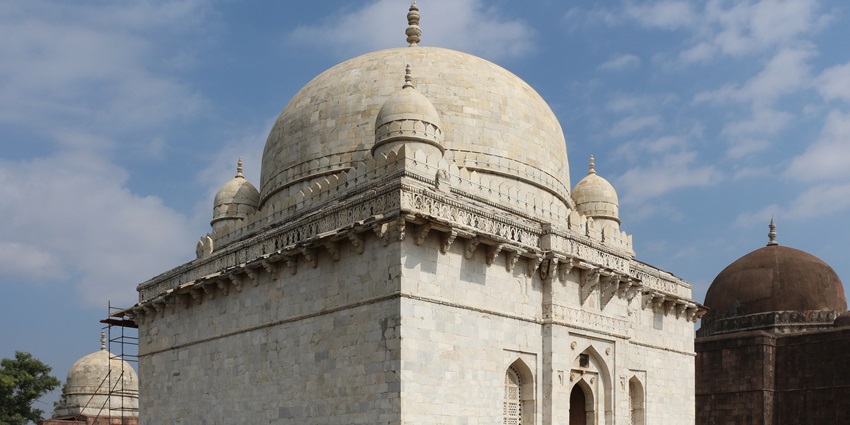 Explore the tomb’s serene gardens and detailed ornamentation, offering a tranquil atmosphere.