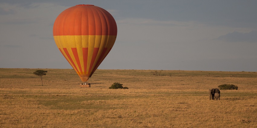 Hot air balloon soaring above Ajmer's serene desert, offering breathtaking panoramic views