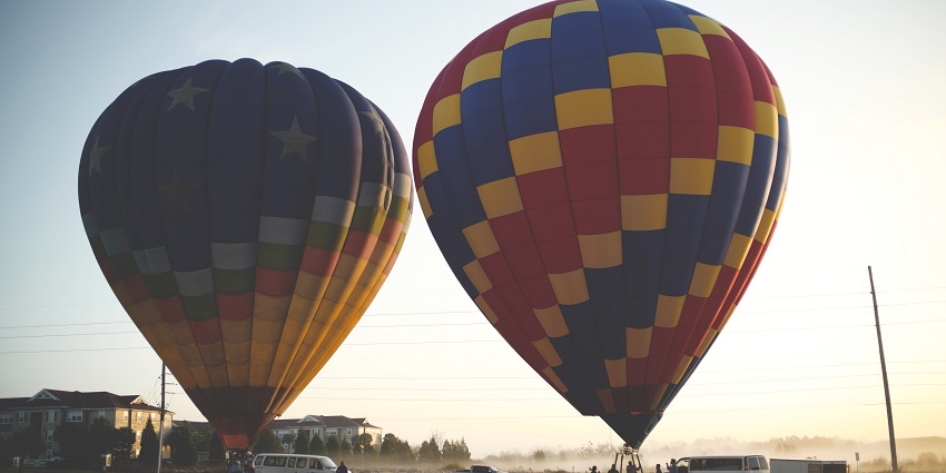 Hot air balloons landing in the deserts of the city
