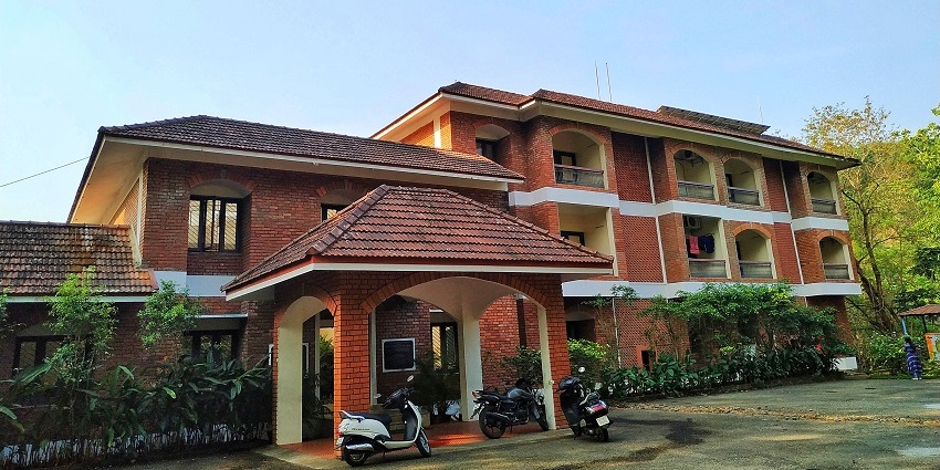 The International Guest House at KFRI Peechi, offering a peaceful stay surrounded by nature.