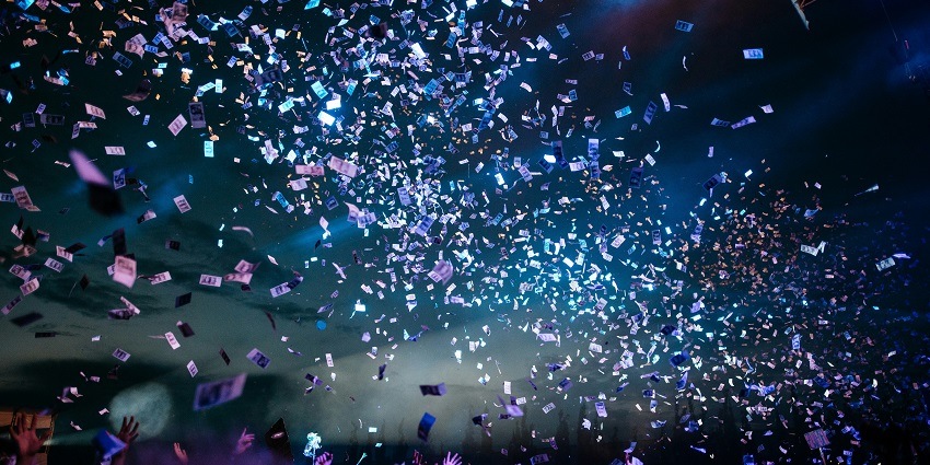 A glimpse of people surrounded by dazzling lights and grooving to the acoustical beats.