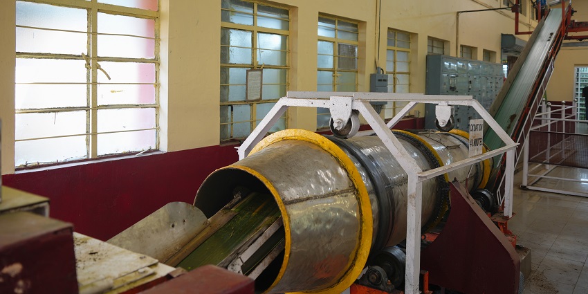 A picture of the interior of a tea museum with a machinery processing tea