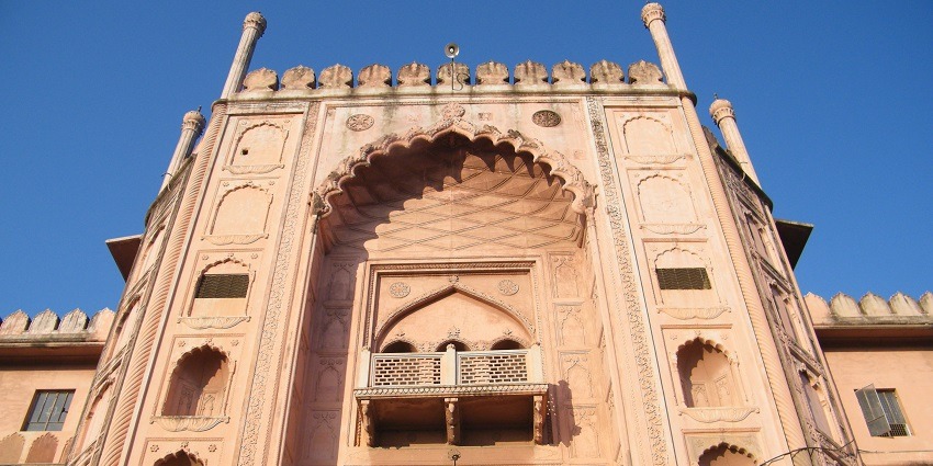 The grand entrance to Taj-ul-Masajid in Bhopal, featuring intricate arches and detailed carvings