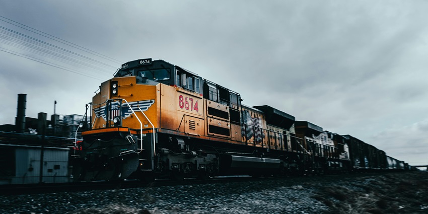 Train passing near the Anokhi Museum, surrounded by scenic landscapes and traditional architecture.