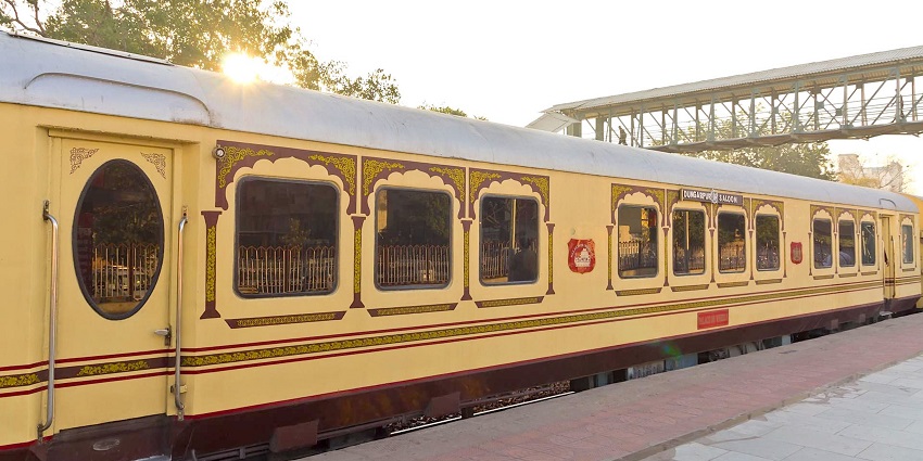 Palace on Wheels luxury train at Jaipur, India, showcasing its elegant and ornate exterior.

