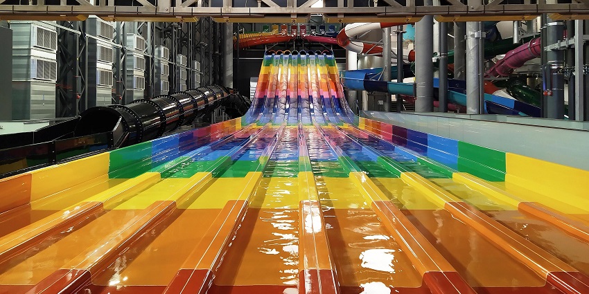 Image of colourful indoor waterslides for kids and adults that can enjoy a safe ride