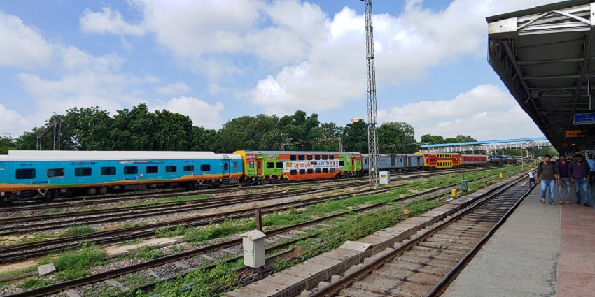 Vibrant Jaipur Railway Station bustling with trains from Delhi, Mumbai, and Kolkata.