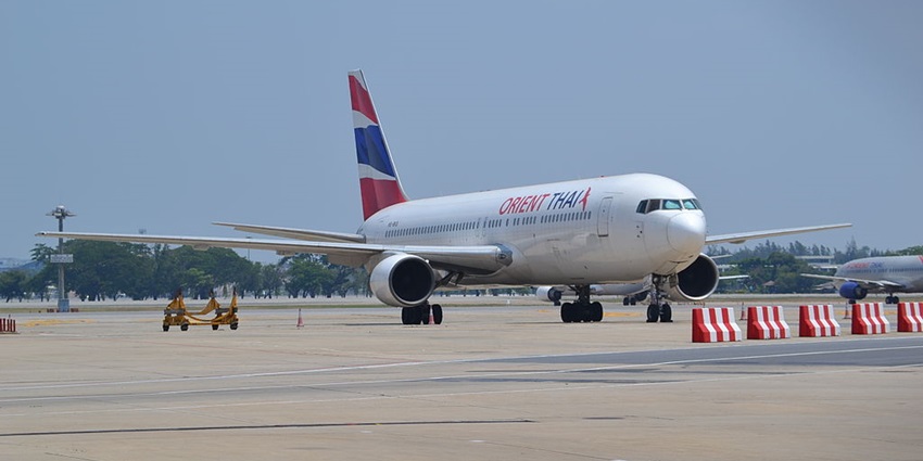 An aeroplane standing at the airport before departure, one of the ways to reach Kalibanga Museum.