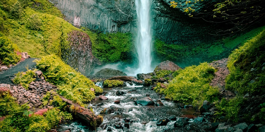 A picture of a waterfall cascading down a rocky terrain