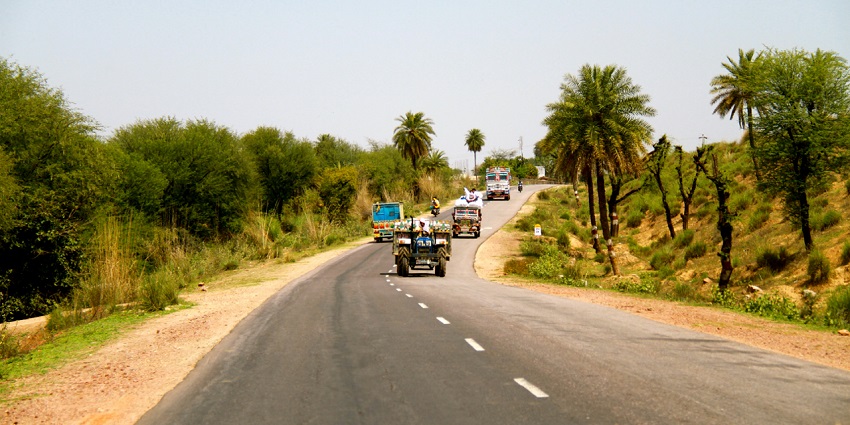 A presenting a network of roads with many vehicles driving to the highway of Kesarbagh Wildlife Sanctuary.