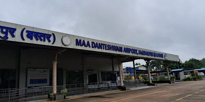 A front view of the airport near Kutumsar Caves with the board showcasing its name.