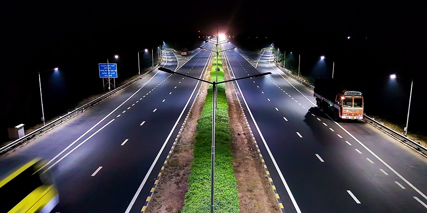 An aerial picture of a highway near the Maharaja Fateh Singh Museum taken during nighttime
