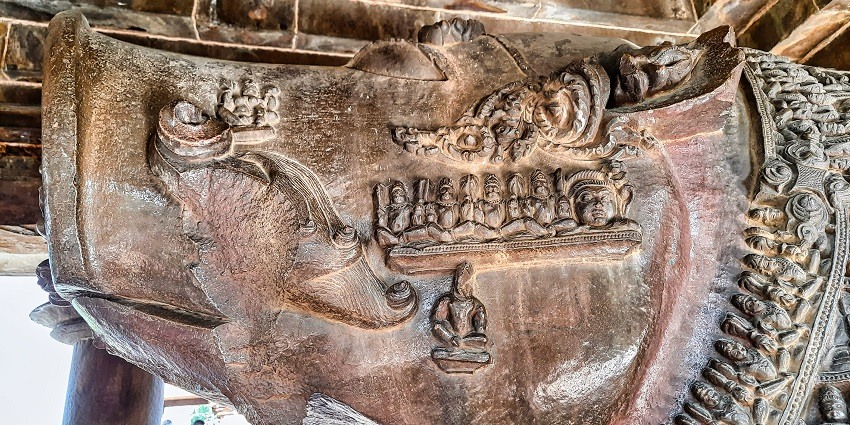 A close up view of the face of the Varaha or the ‘bore’ statue, with many other small sculptures sculpted on its face.