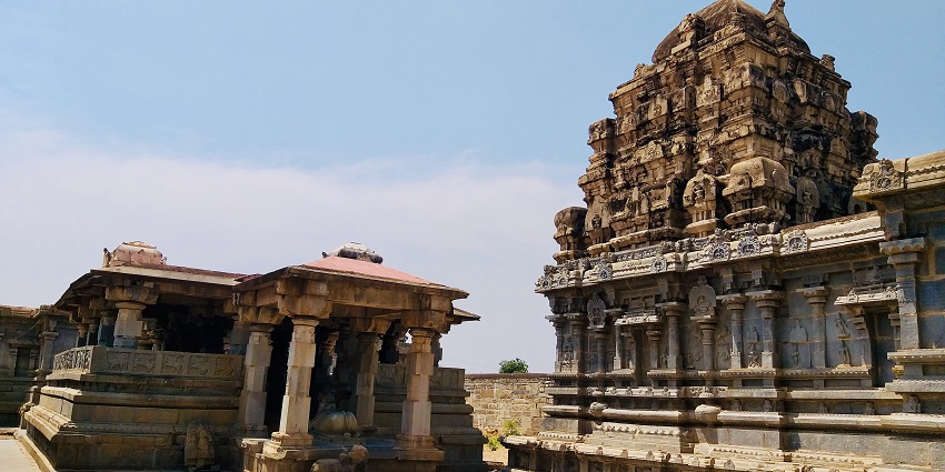 A wide angle shot of the temple, highlighting its architecture and the serene natural surroundings.
