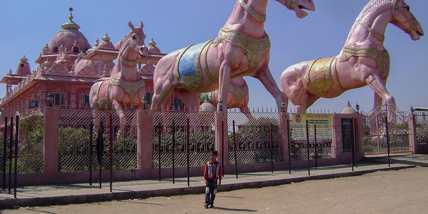 Radha Parthasarathi Temple offers chariot-like architecture, gardens, and serenity.