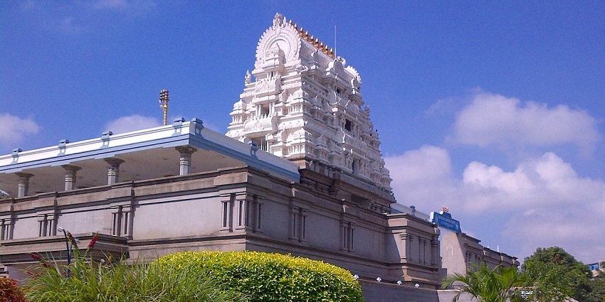 Ornate white and gold ISKCON Temple, a tourist attraction near Central Museum Indore.
