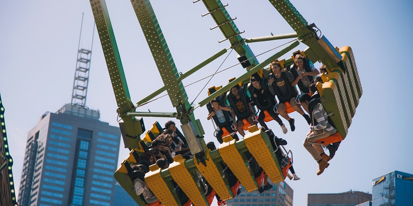 People enjoy roller coaster rides in a theme park, destination near Lonavala for families.