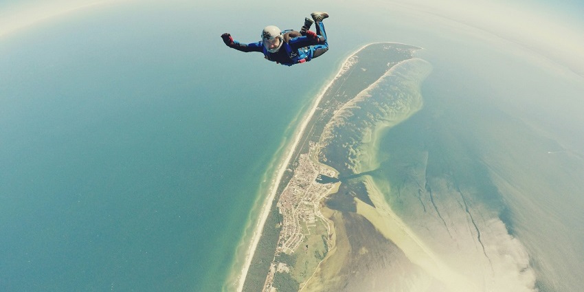 A person gliding up in the air at InFlight Dubai, a top spot for indoor skydiving Dubai.