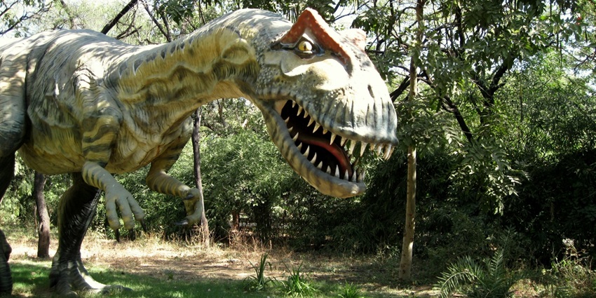 A vibrant dinosaur park in Gandhinagar featuring life-sized dinosaur sculptures
