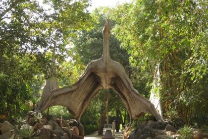 The entrance of Saranthana Nature Park, large gates leading into lush landscapes