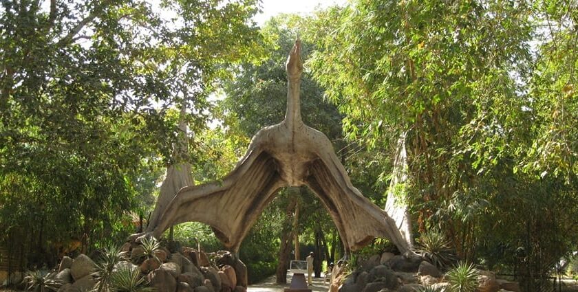 The entrance of Saranthana Nature Park, large gates leading into lush landscapes