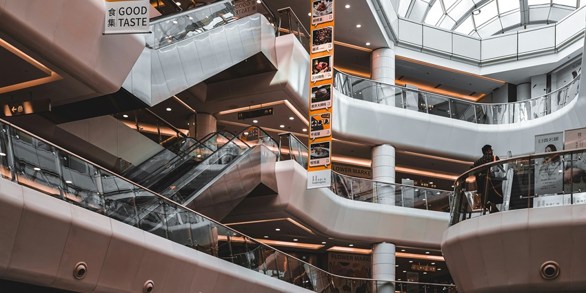 A spacious building features an escalator - places to visit near Toilet Museum Delhi.