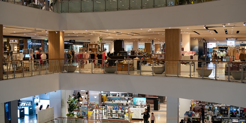 High street view of Iscon Mega Mall with shops and an amusement centre.