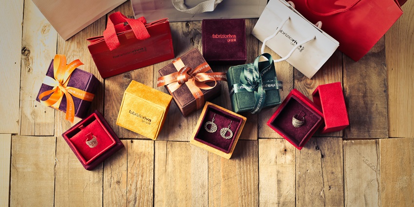 Colorful assorted gift boxes arranged on a wooden floor—shopping malls in gandhinagar