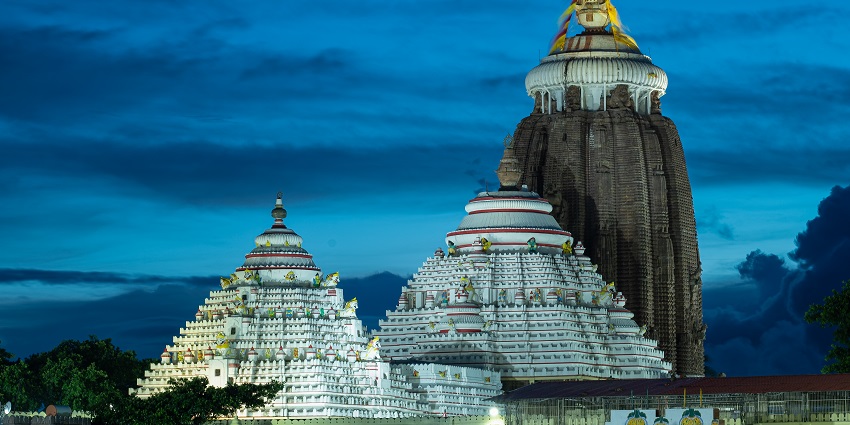 The exterior of the Jagannath Temple is a grand, highly carved building with giant spires.