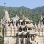 The Jain Temples in Gujarat are surrounded by lush greenery.