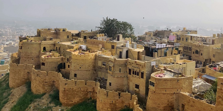 Jaisalmer Fort, built in 1156 AD, features golden sandstone and vibrant shops