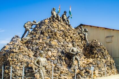 View of the Honour Walls at Jaisalmer War Museum, with a tall Indian flag in the centre