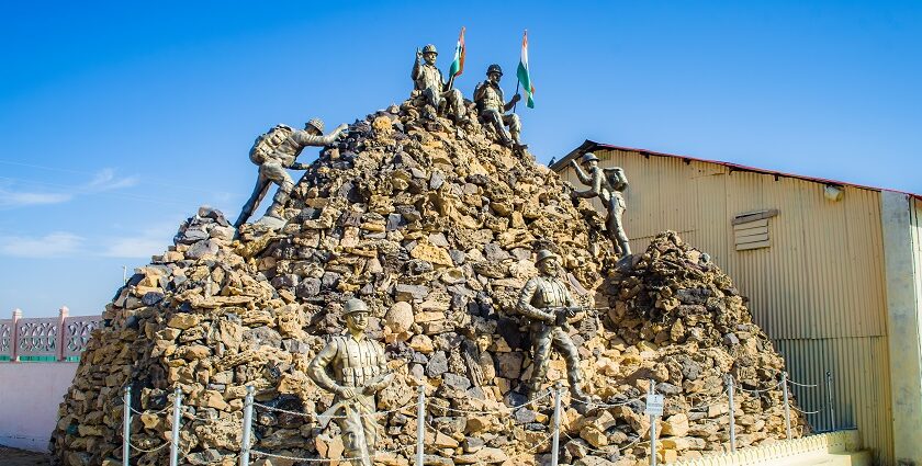 View of the Honour Walls at Jaisalmer War Museum, with a tall Indian flag in the centre