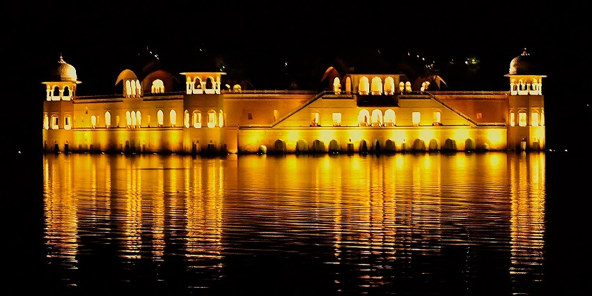 A glimpse of the majestic Jal Mahal surrounded by serene waters casting panoramic views.
