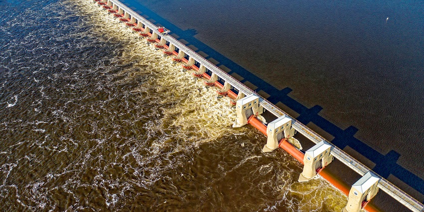 Jalaput Dam reservoir is surrounded by green hills and calm waters